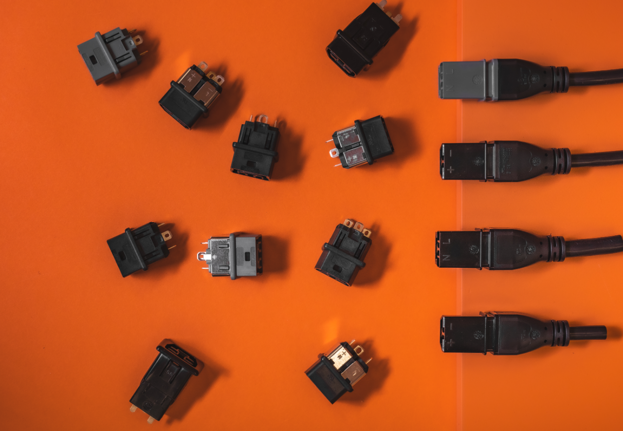 Unmated connectors laying on an orange background
